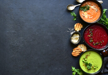 Delicious vegetable soups : carrot, green pea and beetroot. Top view with copy space.