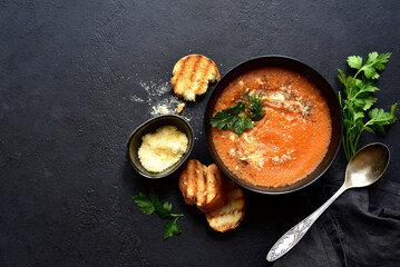 Carrot soup with parmesan and croutons. Top vie with copy space.