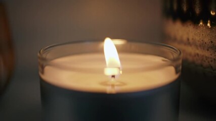 Plants and candles on a white shelf creating a cozy and relaxing atmosphere indoors at night - Powered by Adobe