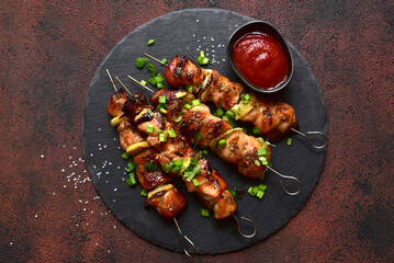 Roasted chicken skewer kebab. Top view with copy space.
