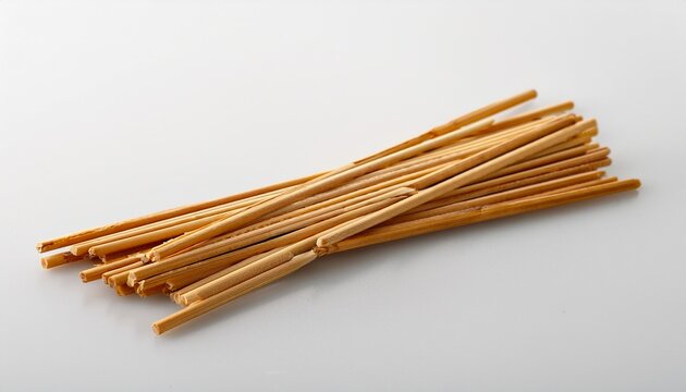 mie lidi sticks on a plain white surface