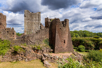Stone ruins of medieval Goodrich Castle in the Wye Valley under a dramatic sky