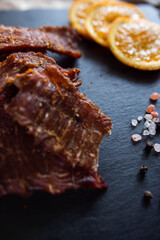 Dehydrated meat in pieces with spices and orange