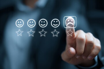 Finger selecting the sad face emoticon indicating a negative experience or feedback on a survey.