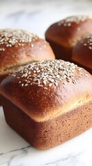 Naklejka premium Golden Brown Artisan Breads with Sunflower Seeds