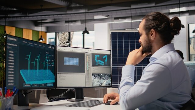 Renewable energy researcher using simulation software to automate solar panels assembly and wind turbines farm infrastructure, improving green industry efficiency, camera A