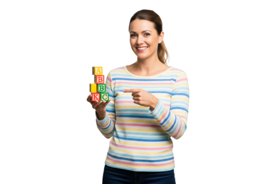 Smiling woman pointing to a stack of ABC alphabet blocks for early education concepts. - Powered by Adobe