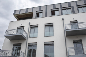 New modern apartment building against cloudy sky