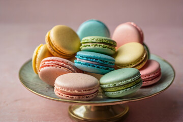Obraz premium Assortment of Colorful French Macarons on a Cake Stand