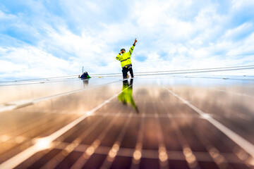 close up on grid of technology renewable solar energy. construction solar panels system on roof....