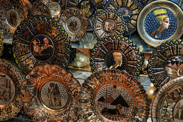 a collection of decorative plates with Egyptian motifs.  