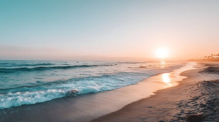 Obraz premium A serene beach scene at sunset, showcasing soft pastel colors and gentle waves lapping at the shore.
