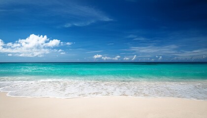 Fototapeta premium serene tropical beach with gentle waves rolling onto white sand under a blue sky