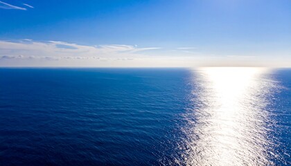 Fototapeta premium Vast ocean stretches under a vibrant sky