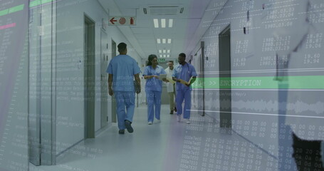 Walking staff wearing scrubs discussing patient charts in hospital corridor with encryption overlay