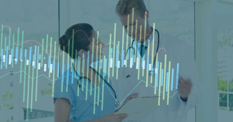 Reviewing tablet data overlays, nurse in scrubs and doctor in lab coat consulting in bright hallway