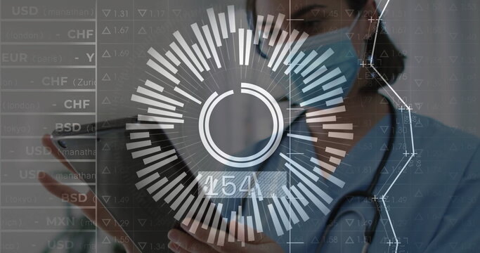 Showing doctor wearing mask using tablet showing exchange rate overlay in clinic, with stethoscope - Powered by Adobe