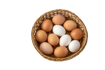 Overhead shot of a woven basket filled with a mix of brown and white chicken eggs against a white background, food and nutrition