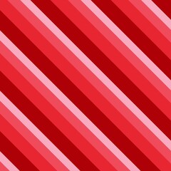 Obraz premium A seamless, repeating pattern of diagonal stripes in various shades of red and pink, creating a bold, candy-cane-like design. The dynamic lines suggest movement and energy.