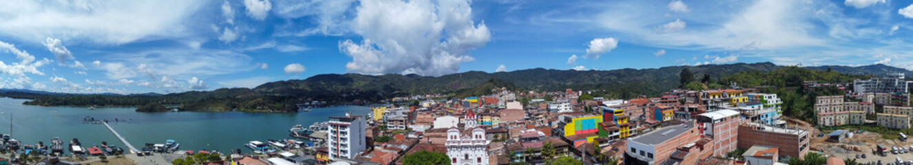 Obraz premium Guatape, Antioquia, Colombia. August 12, 2025. Aerial drone view. Municipality with 8,941 inhabitants.
