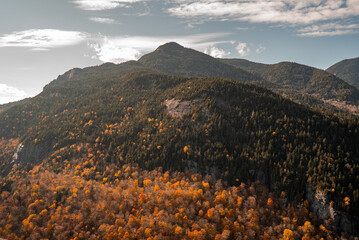 Up State New York in the Adirondack State Park during peak Fall Autumn season with golden maple...