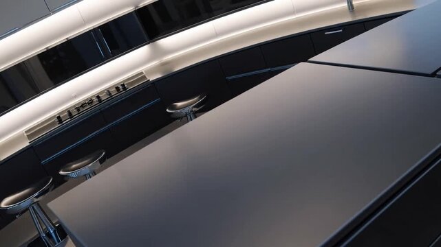 contemporary kitchen design featuring monochromatic black and silver metallic color scheme, minimalist principles, elongated central island with seating, and dark materials with subtle blue-silver ac