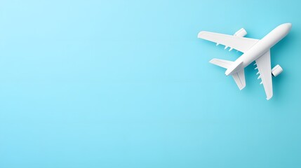 White Airplane Model on Blue Background Travel Concept