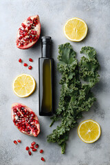 Fresh baby kale with citrus fruits and olive oil bottle perfect for diet blog wellness content and nutrition design