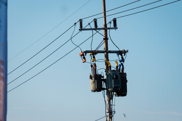 Electrical Power Distribution Pole with Transformers and Wires, Delivering Essential Energy Against...
