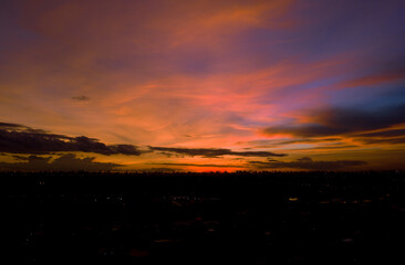 Obraz premium Aerial view from drone of construction site with cranes. Steel frame structure, structural steel beam build large buildings at construction site