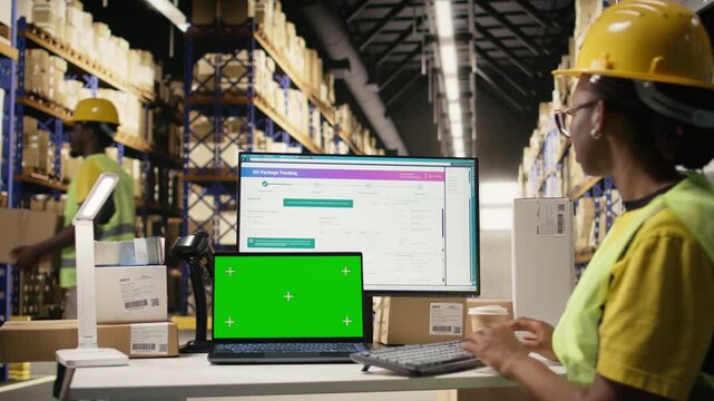 African american worker following shipments with tracking info next to copy space, warehouse operations with organized shelving and pallets. Accurate logistics and timely order dispatch. Camera A.