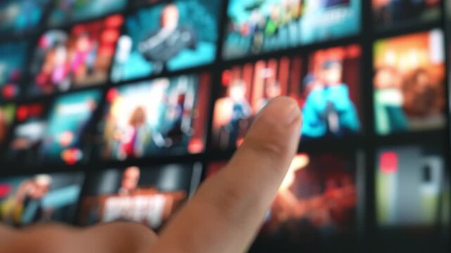 Using a fingertip gesture to navigate entertainment on a big TV showcases touchless technology, digital convenience, user empowerment, smart homes, and personalized media experiences.
