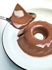 Homemade Chocolate Pudding Being Eaten with a Spoon