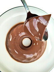 Enjoying a Scoop of Smooth and Creamy Chocolate Pudding