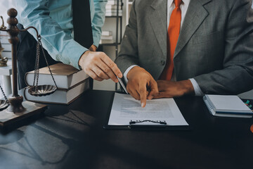 Lawyer explained to the client about the law that must be brought against the court case.