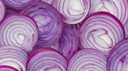 Obraz premium Close-Up of Fresh Purple Onion Slices Arranged in Overlapping Pattern