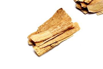 Dried Astragalus root slices used in traditional Chinese medicine.