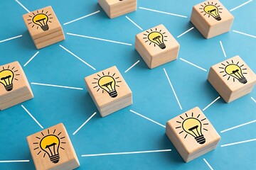 Network of Wooden Blocks with Lightbulb Icons Representing Ideas and Connections innovation