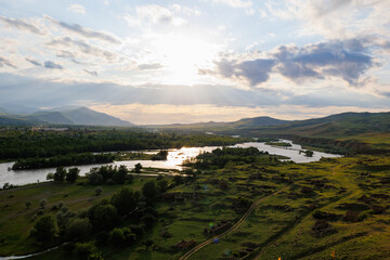 Scenic sunset views looking across the Kura River from the top of the ancient rock town of Uplistsikhe near the city of Gori, Georgia © hyserb
