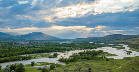 Scenic sunset views looking across the Kura River from the top of the ancient rock town of Uplistsikhe near the city of Gori, Georgia © hyserb
