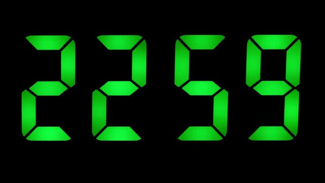 Green digital clock displays 11:00 PM or 23-00 with a count of a few seconds, green digits on a black background.