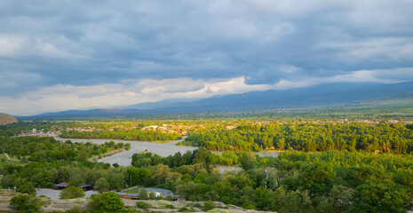 Scenic sunset views looking across the Kura River from the top of the ancient rock town of Uplistsikhe near the city of Gori, Georgia © hyserb