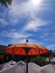 umbrella with clouds in the background in a beautiful morning