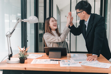 Team celebration at office business meeting collaborative environment positive atmosphere joyful interaction