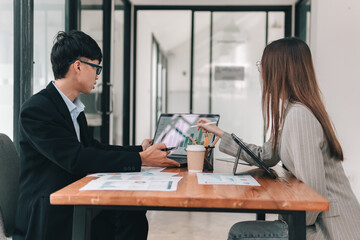 Collaborative business meeting professionals discussing teamwork in a modern office setting