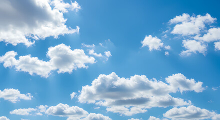 Fototapeta premium A vibrant blue sky dotted with fluffy white clouds.