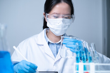 Chemist scientist working in laboratory science research test experiment data analysis report document biochemistry