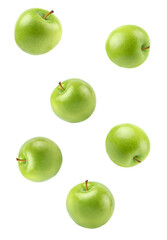 a scattering of green apples against a dark backdrop