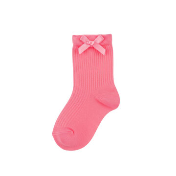 Pink ribbed baby sock with delicate bow detail isolated on white background