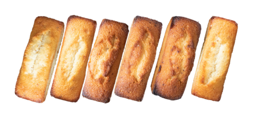 neat row of golden almond financiers on black backdrop